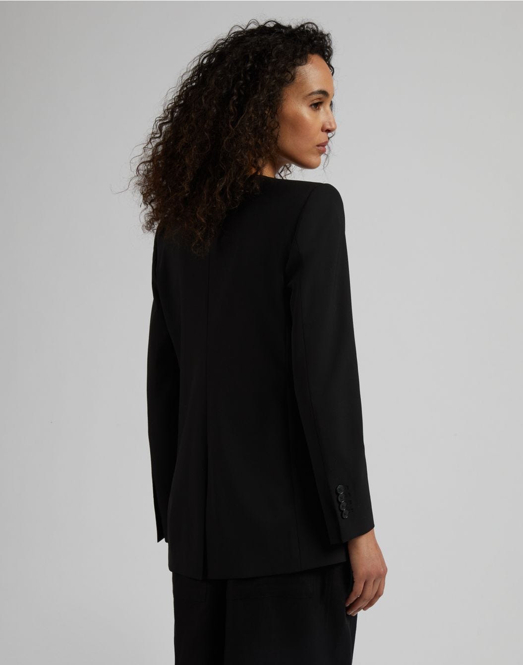 Lardini Giacca monopetto senza collo in tela di lana stretch nera Saldi Di Fabbrica