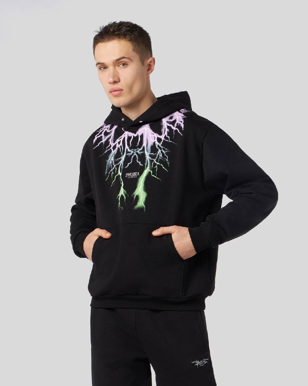 Phobia Archive FELPA NERA CON FULMINI BICOLORE VIOLA E VERDE Vendita Calda