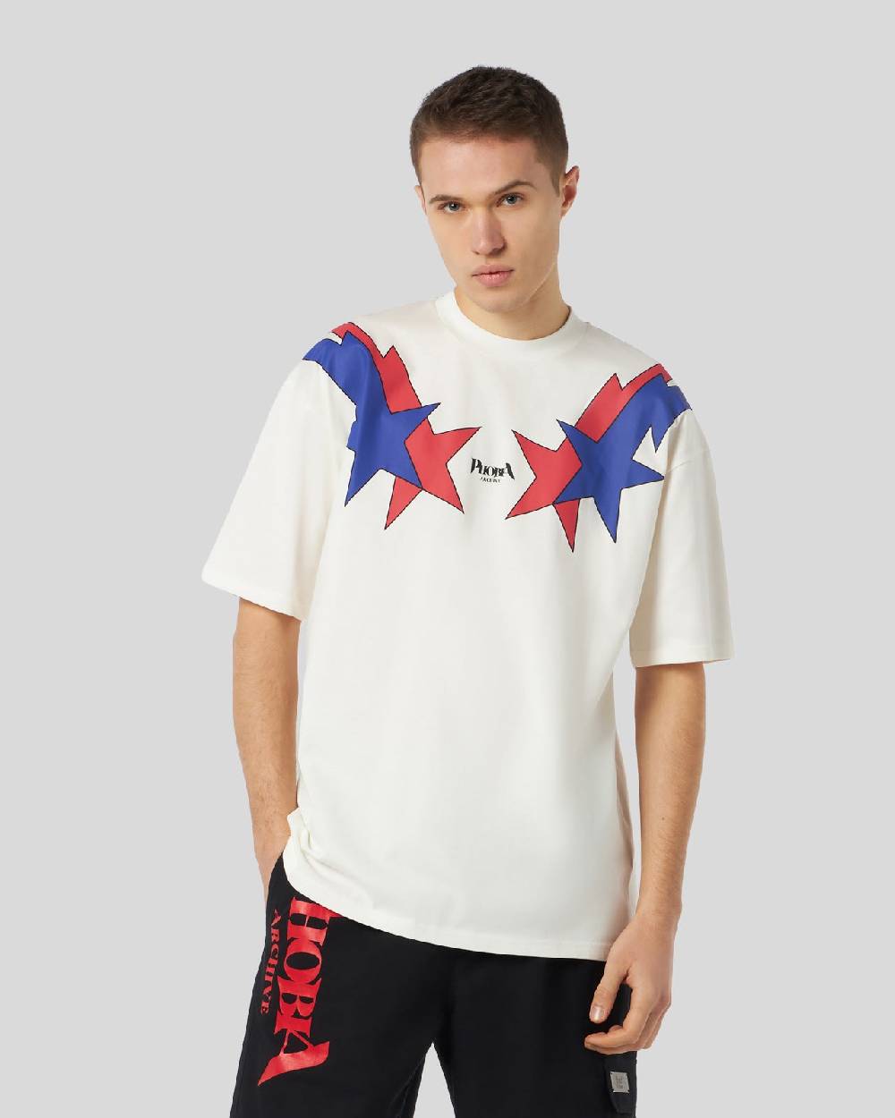 Phobia Archive T-SHIRT BIANCA CON GRAFICA STARRY LIGHTNING ROSSA E BLU Nuovo