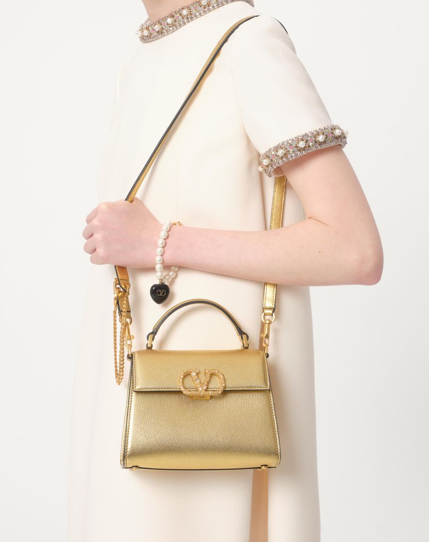 Valentino Handbags Borsa A Mano Mini Valentino Garavani Vsling In Vitello Granato Laminato Con Logo Gioiello per Donna in Antique Brass | Valentino IT Economico