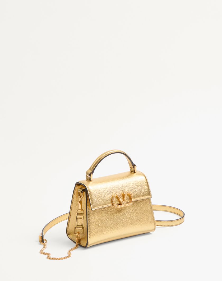 Valentino Handbags Borsa A Mano Mini Valentino Garavani Vsling In Vitello Granato Laminato Con Logo Gioiello per Donna in Violet | Valentino IT Vendita Economica
